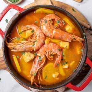 pot of Catalan fish stew on a board.