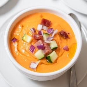 melon gazpacho garnished with veg and ham.