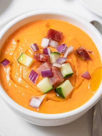 melon gazpacho garnished with veg and ham.