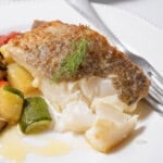 pan fried cod fillet with veggies.