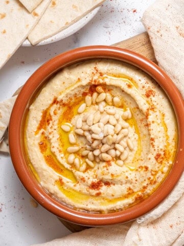 bowl of Spanish hummus with tortillas.