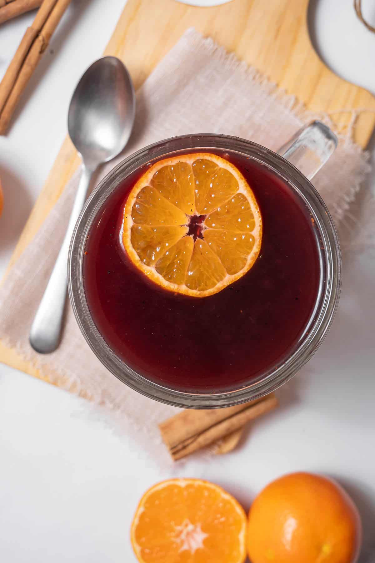 mug of hot wine with a slice of orange.