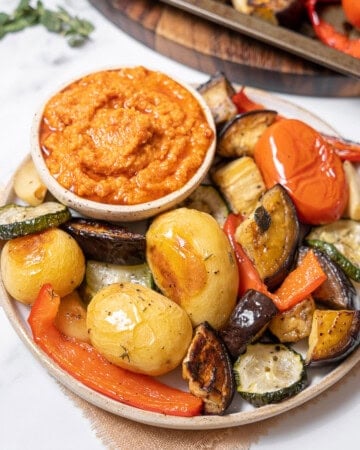 plate of roasted vegetables with dip.