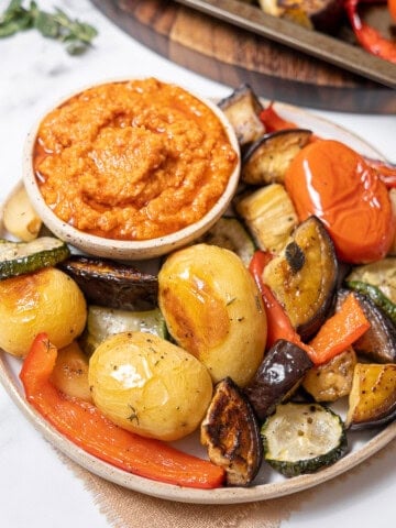 plate of roasted vegetables with dip.