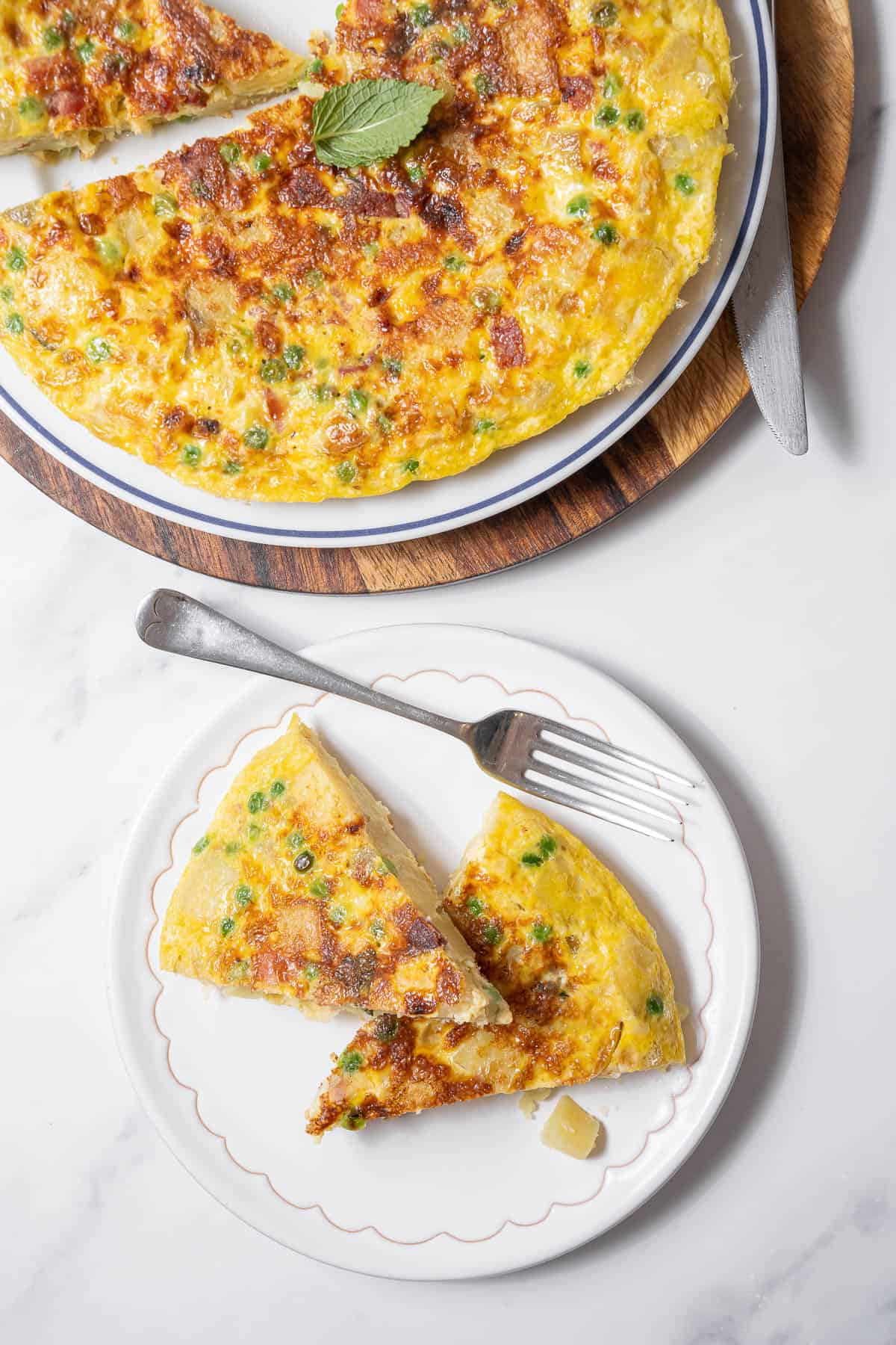 two slices of tortilla with ham and peas.