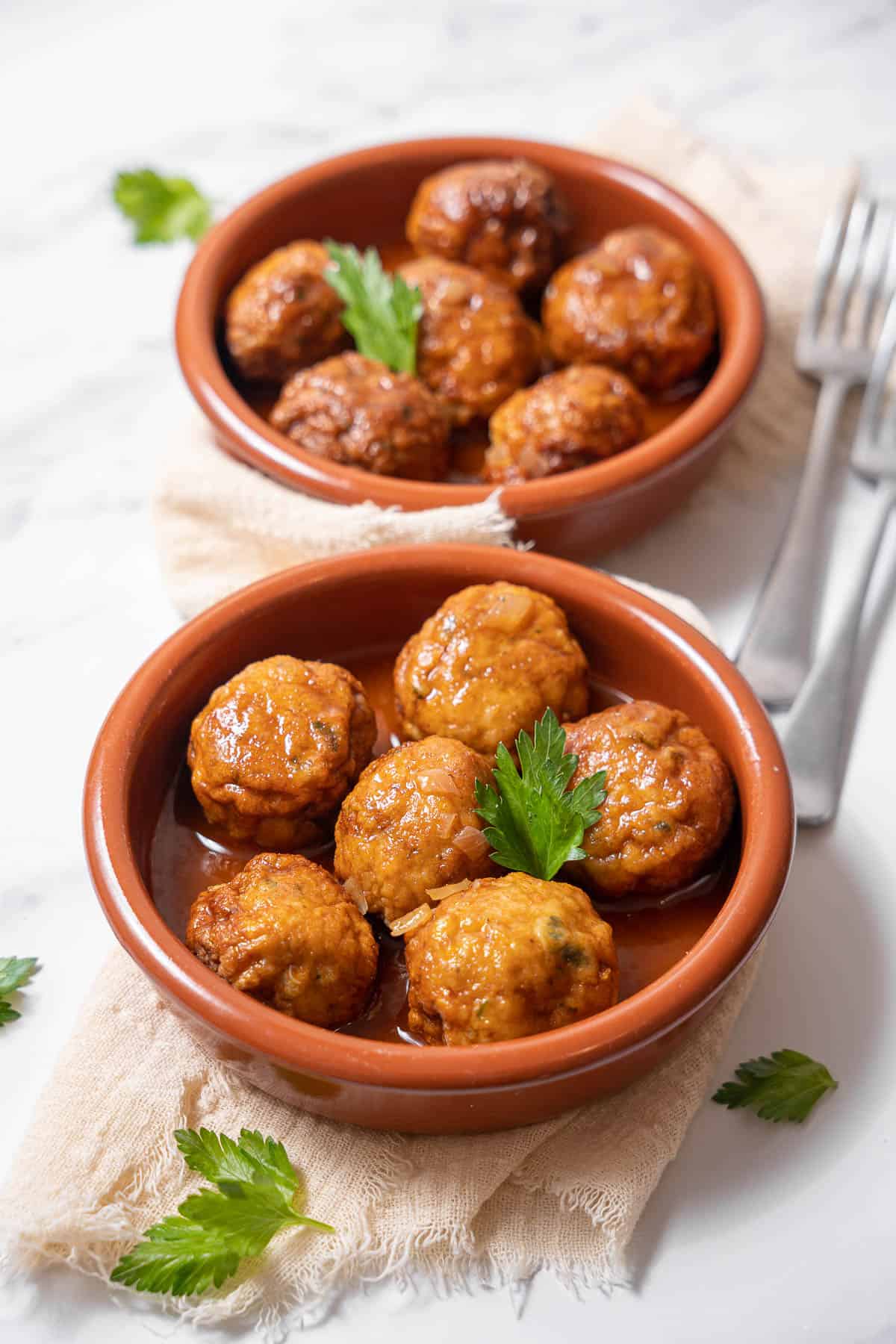 two bowls of cuttlefish meatballs.