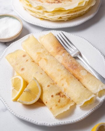 plate of three frisuelos with a fork.