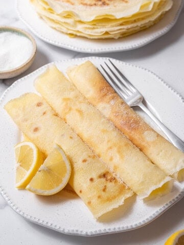 plate of three frisuelos with a fork.