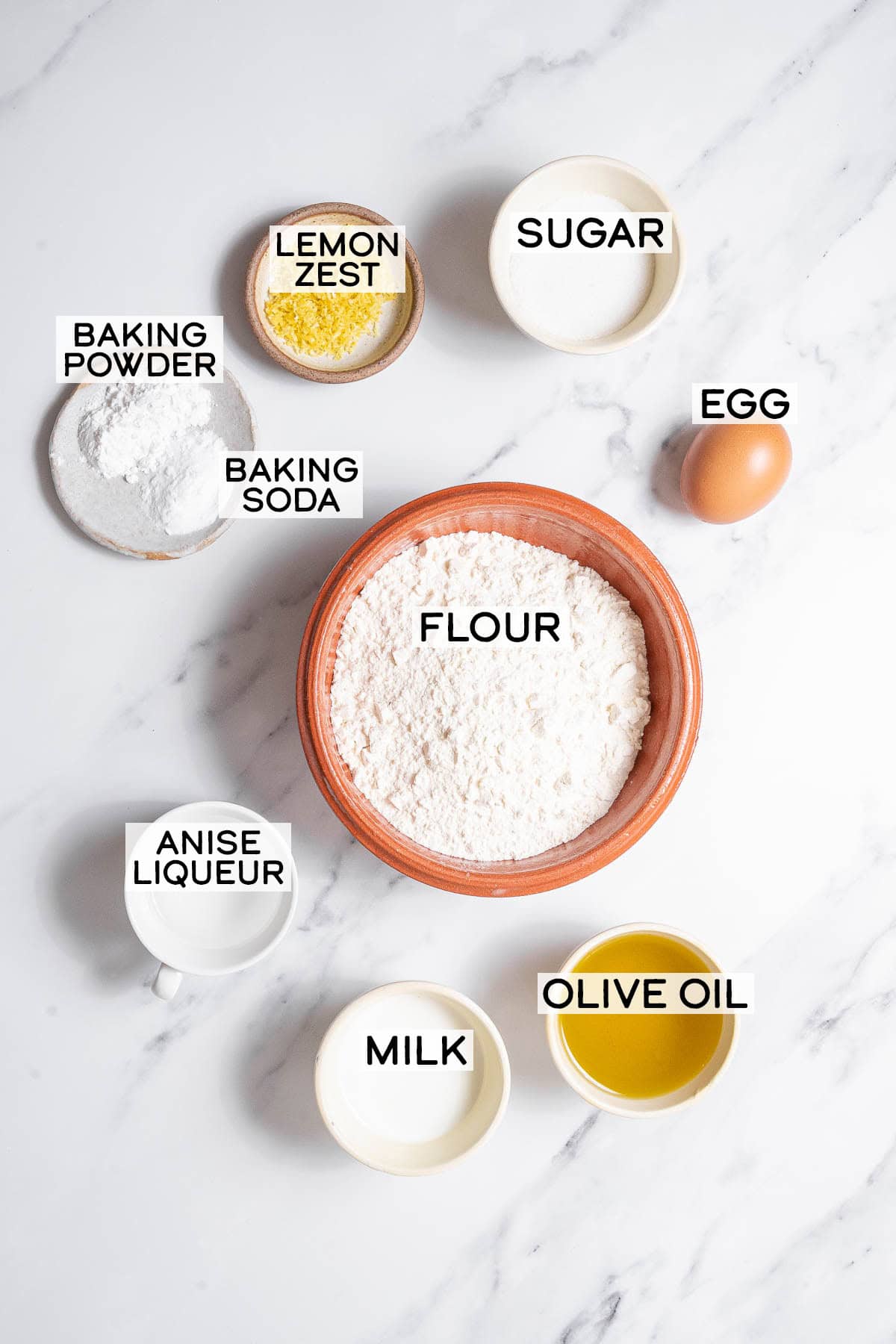 bowls of ingredients for fried donuts.