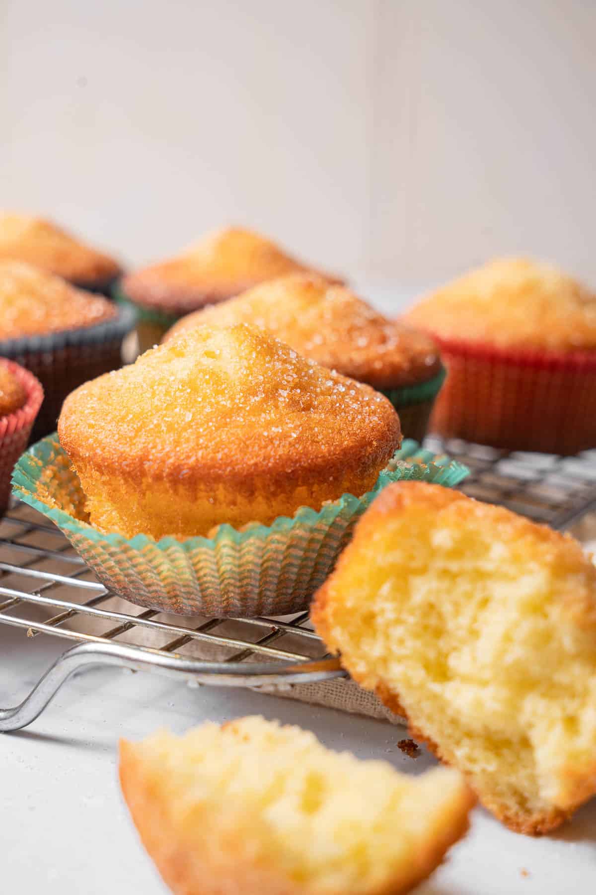 baked magdalenas on a wire rack.