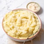 bowl of manchego mashed potatoes with a spoon.