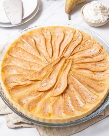 pear tart on a glass plate.