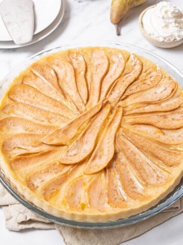 pear tart on a glass plate.