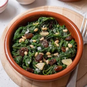 bowl of spinach with pine nuts.