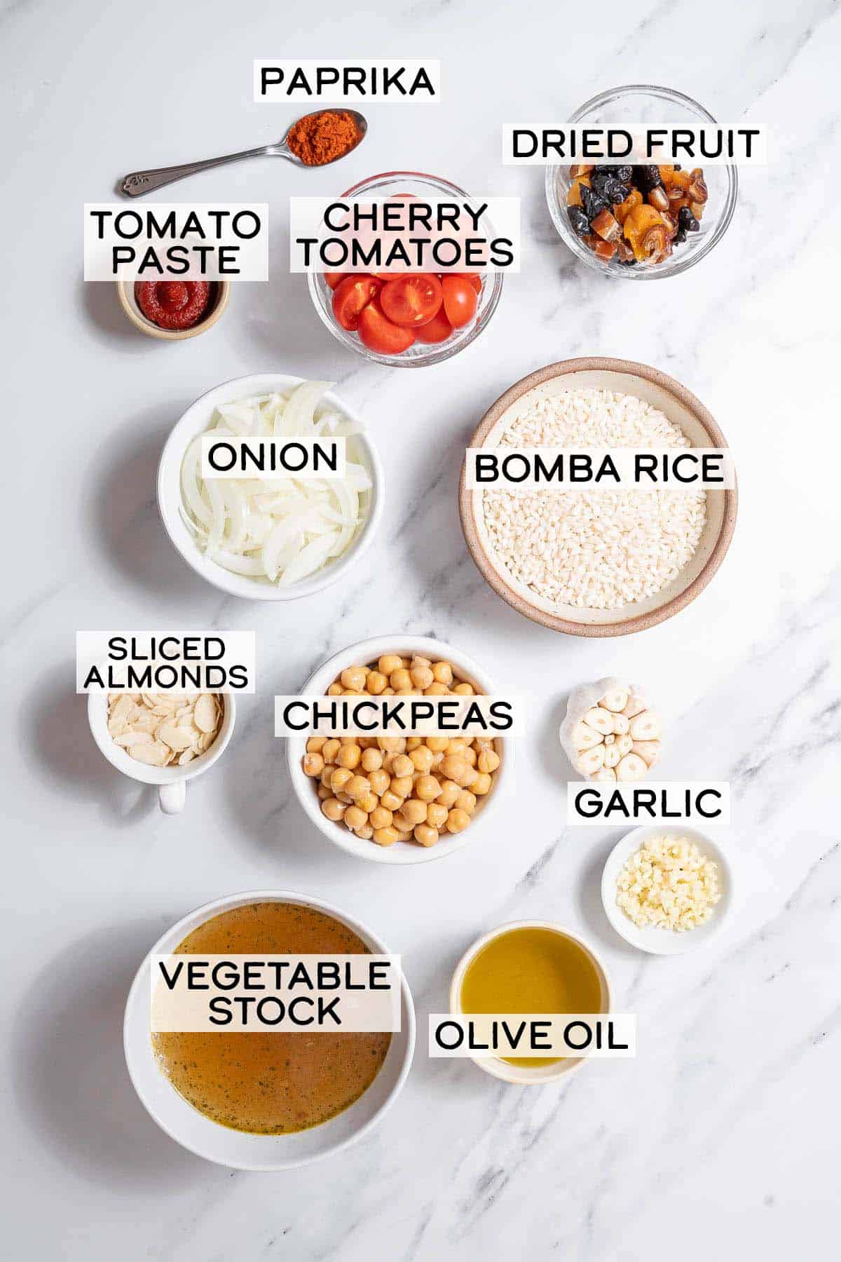 bowls of ingredients for baked rice with garbanzos.