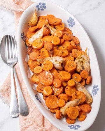 plate of roasted carrots with garlic.