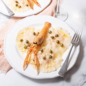 plates of poached langoustine ravioli.