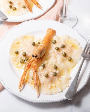 plates of poached langoustine ravioli.