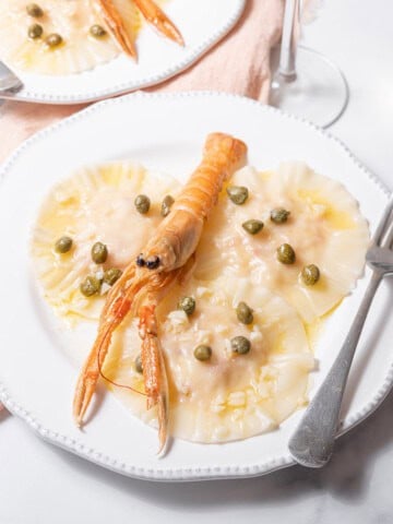 plates of poached langoustine ravioli.