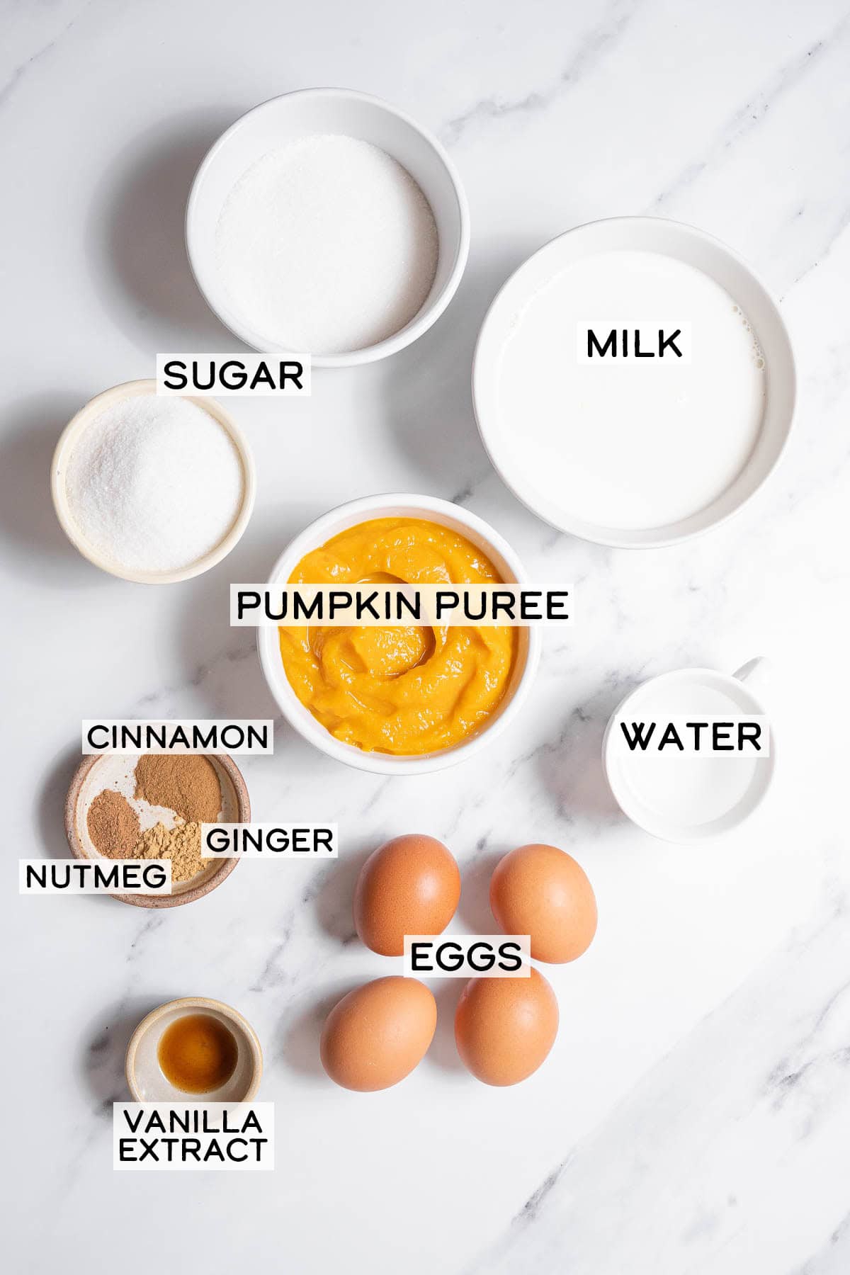 bowls of ingredients for pumpkin flan.